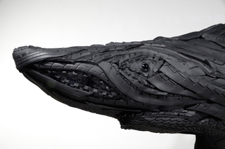 Illustration for article titled This Artist Turns Old Tires Into Dark, Disturbing Nightmare Monsters